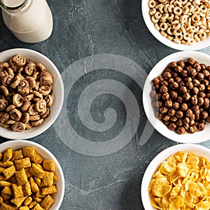 Variety of cold cereals in white bowls