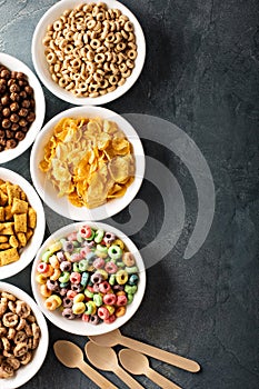 Variety of cold cereals in white bowls