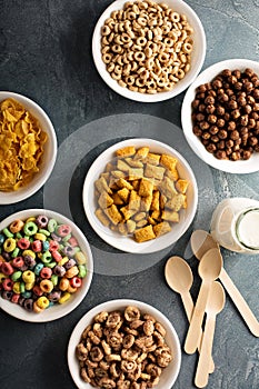 Variety of cold cereals in white bowls