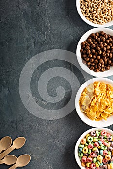 Variety of cold cereals in white bowls