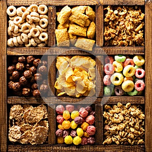 Variety of cold cereals in a wooden box overhead