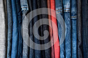 Variety of colored denim fabric samples for different jeans styles. Concept Colored Denim, Fabric