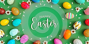 Variety of colored eggs with white flowers decoration and Happy Easter text on green background