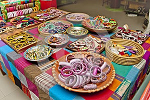 Variety colored handmade bangles are displayed