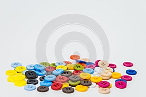 Variety colorful button on white background and selective focus