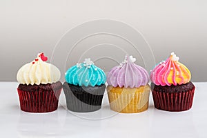 Variety colorful cute cupcake on white background