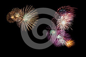 Variety of colorful fireworks isolated on black background