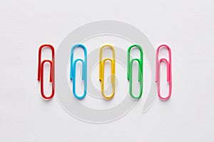 Variety of colorful paper clips in a row
