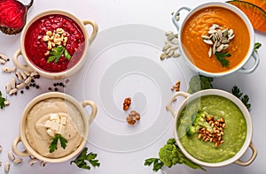 Variety of colorful vegetables cream soup: with broccoli, beets, white beans and pumpkins, healthy eating concept, Copy space,