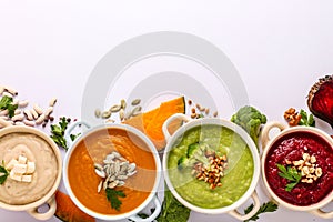 Variety of colorful vegetables cream soup: with broccoli, beets, white beans and pumpkins, healthy eating concept, Copy space,