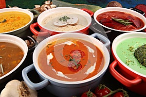 Variety of colorful vegetables cream soups and ingredients for soup. Concept of healthy eating or vegetarian food with mushrooms