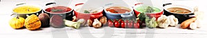 Variety of colorful vegetables cream soups and ingredients for soup. Concept of healthy eating or vegetarian food with mushrooms