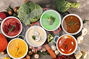 Variety of colorful vegetables cream soups and ingredients for soup. Concept of healthy eating or vegetarian food with mushrooms