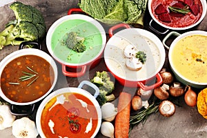 Variety of colorful vegetables cream soups and ingredients for soup. Concept of healthy eating or vegetarian food with mushrooms