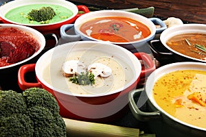 Variety of colorful vegetables cream soups and ingredients for soup. Concept of healthy eating or vegetarian food with mushrooms