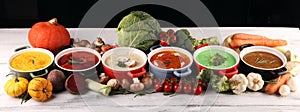 Variety of colorful vegetables cream soups and ingredients for soup. Concept of healthy eating or vegetarian food with mushrooms