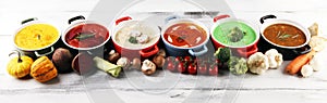 Variety of colorful vegetables cream soups and ingredients for soup. Concept of healthy eating or vegetarian food with mushrooms