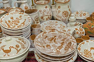 Variety of Colorfully Painted Ceramic Pots in an Outdoor Shopping Market. pottery in the shop window