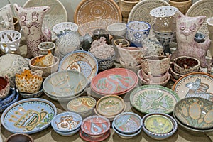 Variety of Colorfully Painted Ceramic Pots in an Outdoor Shopping Market. pottery in the shop window