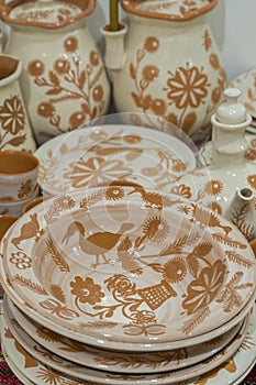 Variety of Colorfully Painted Ceramic Pots in an Outdoor Shopping Market. pottery in the shop window. vertical photo