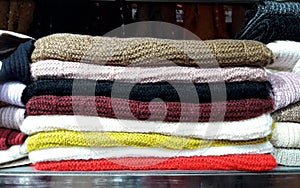 Variety colors of napery clothes arranged on selves, Decoration. photo