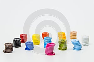 Variety column of colorful button on white background and selective focus