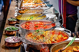 Variety of cooked curries on display at Camden Market