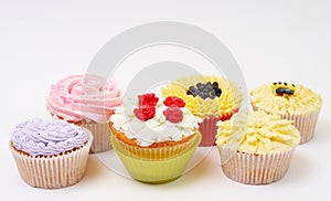 Variety of cupcakes with decorative techniques