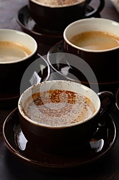 Variety of cups of coffee and coffee beans