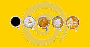 Variety of cups of coffee on colour background