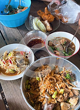 a variety of dishes on a wooden table
