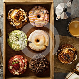 Variety of donuts in a wooden box