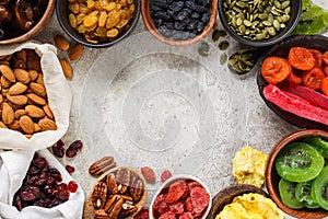 Variety of dry fruits and nuts in bowls, copy space. Healthy food concept, white background