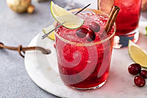 Variety of festive Christmas cocktails with cranberry and lime