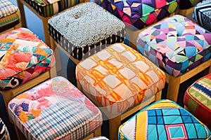 a variety of finished footstools displayed in patterns