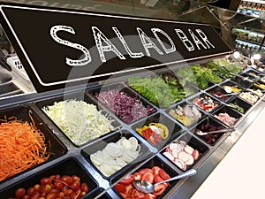 Variety of fresh colorful vegetable and fruit at salad bar corner