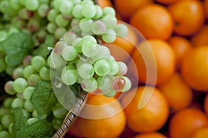 Variety of fresh fruits, grapes, oranges