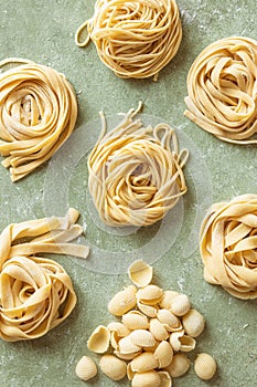 Variety of fresh raw uncooked homemade pasta.