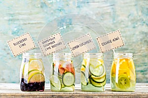 Variety of fruit infused detox water in jars