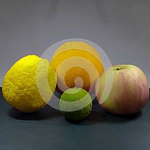 variety of fruits such as lemon, orange, apple and lime as vitamins supply healthy food to boost immune system