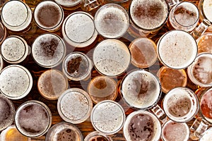 A variety of full, frothy lager glasses and sizes