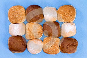 Variety of hamburger buns isolated on blue