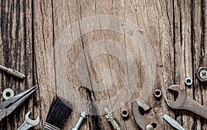 Variety Handy Tools on grunge wooden background. Top view close