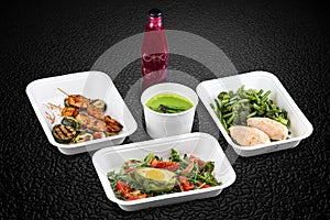 A variety of healthy and delicious meal options packed in eco-friendly containers for a convenient and sustainable way to eat