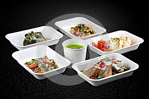 A variety of healthy and delicious meal options packed in eco-friendly containers for a convenient and sustainable way to eat