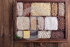 Variety of healthy grains and seeds in a wooden box