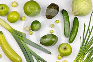 Variety of healthy organic vegetables only green color on white background. Top view of ripe, raw and juice vegetables.