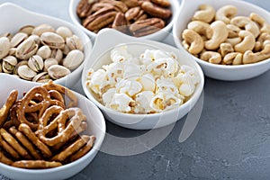 Variety of healthy snacks in white bowls