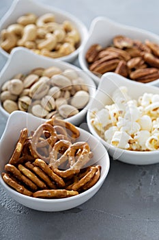 Variety of healthy snacks in white bowls photo