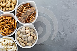 Variety of healthy snacks in white bowls